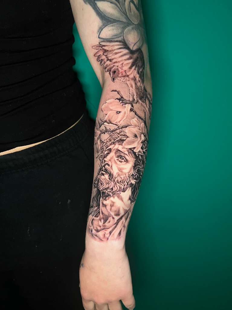 Black and grey religious sleeve tattoo, full arm view by Alison at Inked City Tattoos in Trenton, NJ