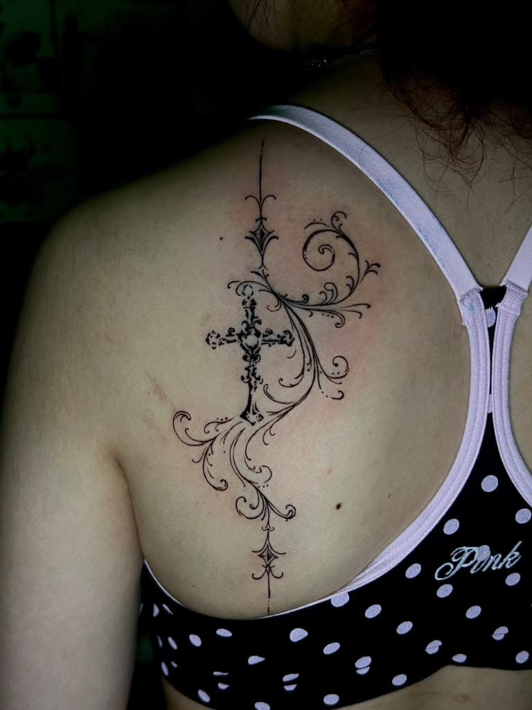 Fine line ornamental cross and filigree spine tattoo by Alison at Inked City Tattoos in Trenton, NJ