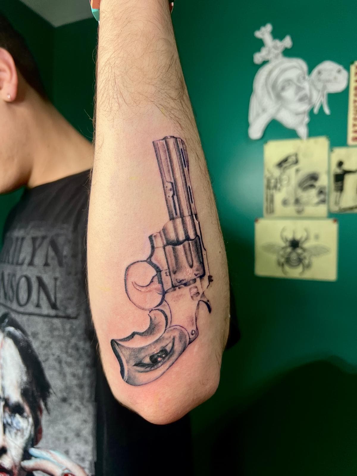 Black and grey realism revolver tattoo, side view by Alison at Inked City Tattoos in Trenton, NJ